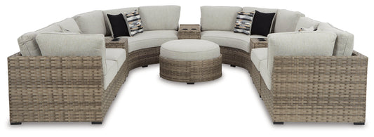Calworth Outdoor 9-Piece Sectional with Ottoman Ashley